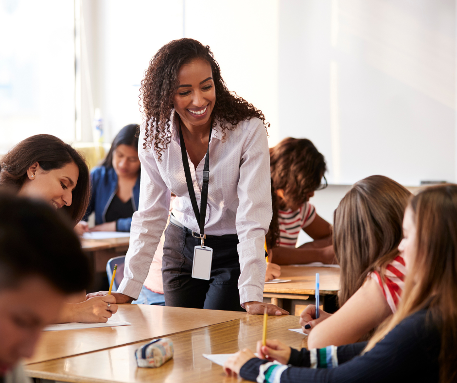 Headteacher talking to students in lesson